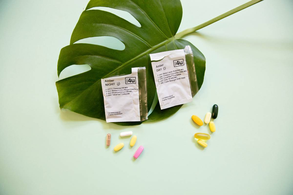woman taking daily digest digestive enzymes with water during lunch for optimal gut function